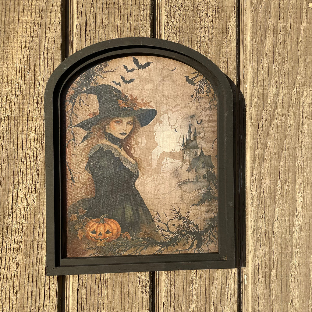 Witch in forest with castle canvas print in small arch