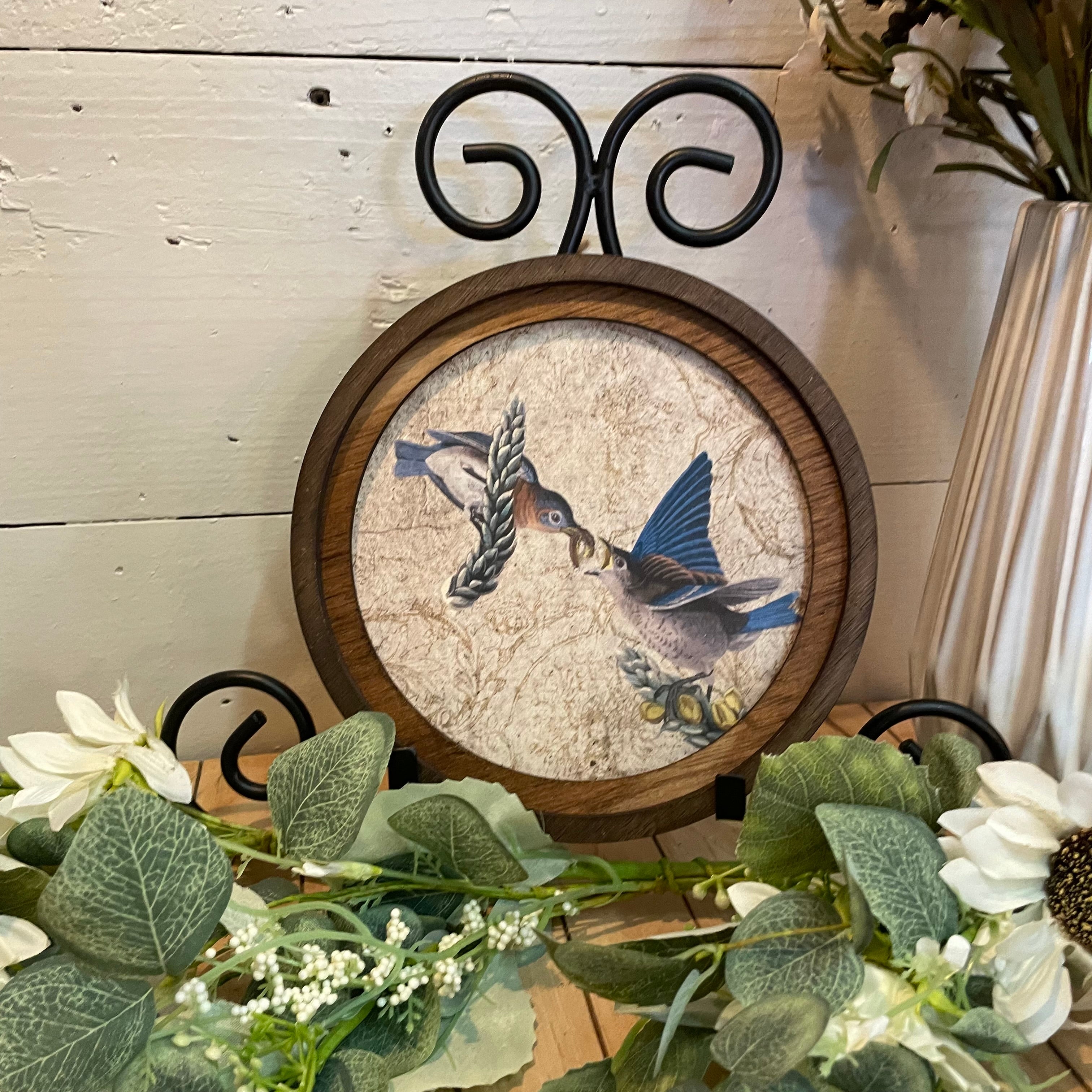 Round Blue Birds Feeding canvas print in round frame