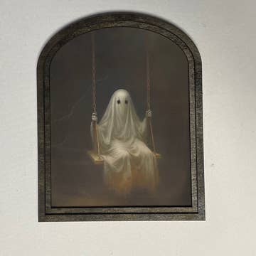 Ghost Swinging in Small Arched Frame
