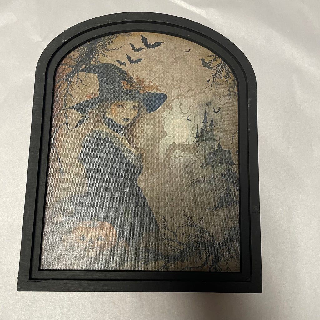 Witch in forest with castle canvas print in small arch