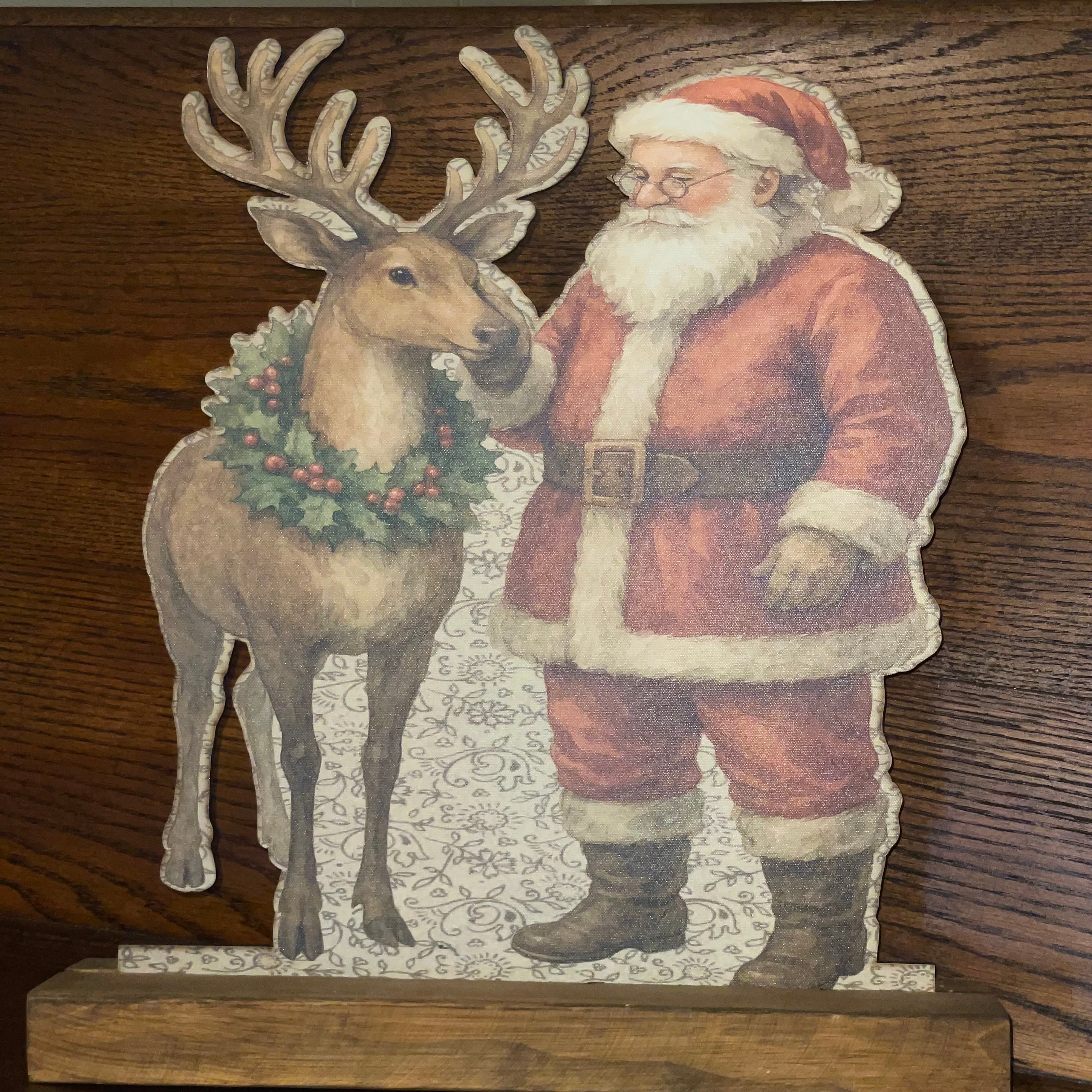 Santa rubbing reindeer Standup