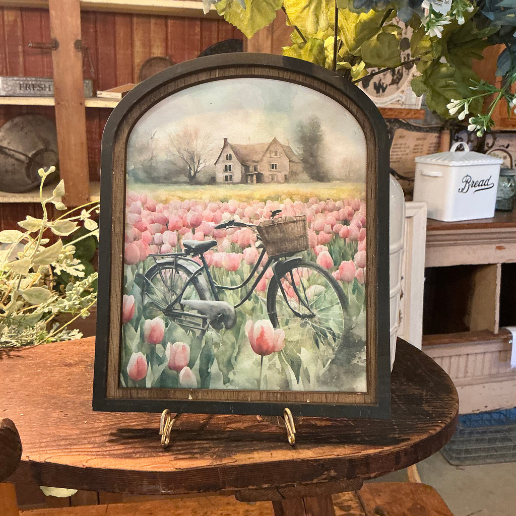 Vintage bicycle in meadow of tulips in Arched Frame