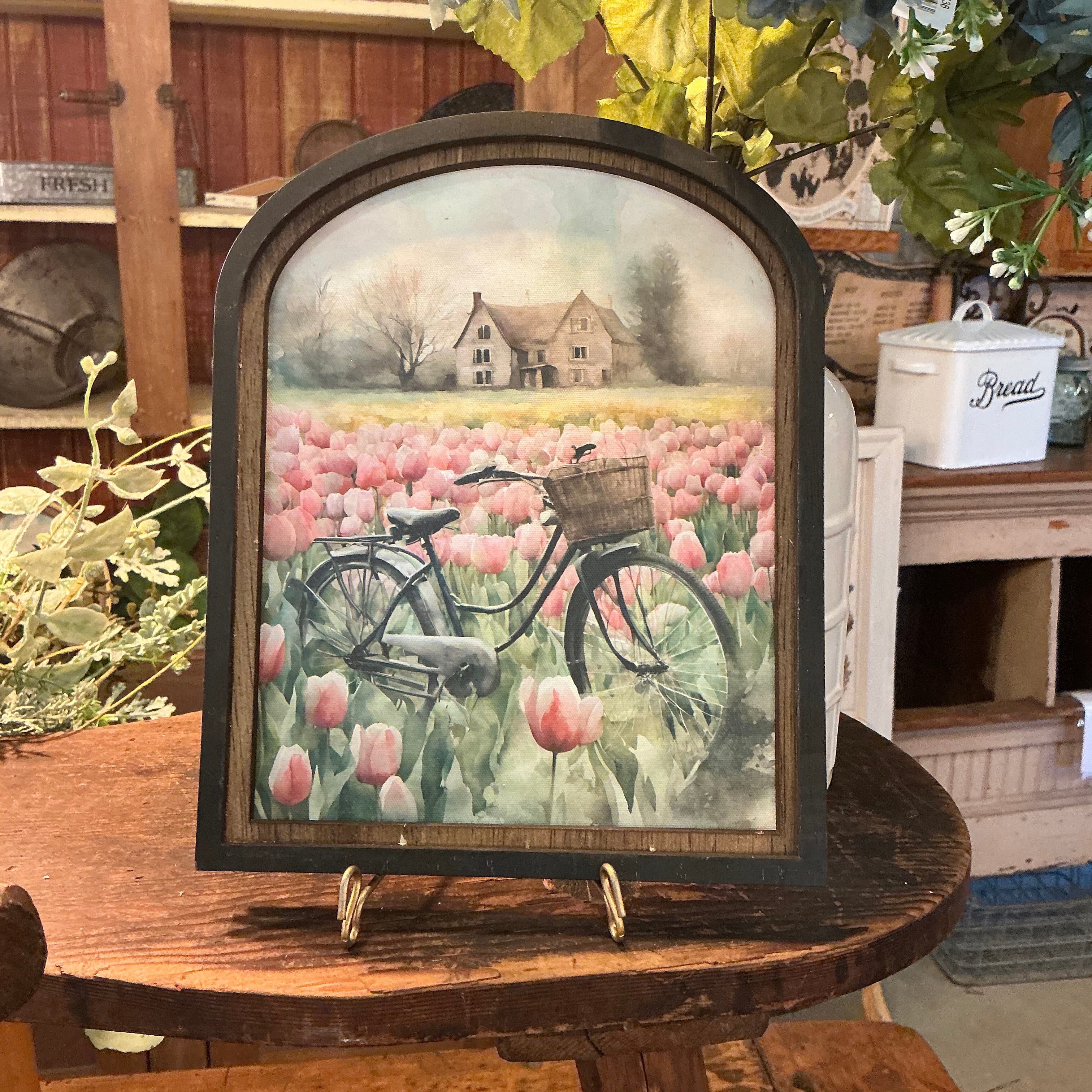 Vintage bicycle in meadow of tulips in Arched Frame