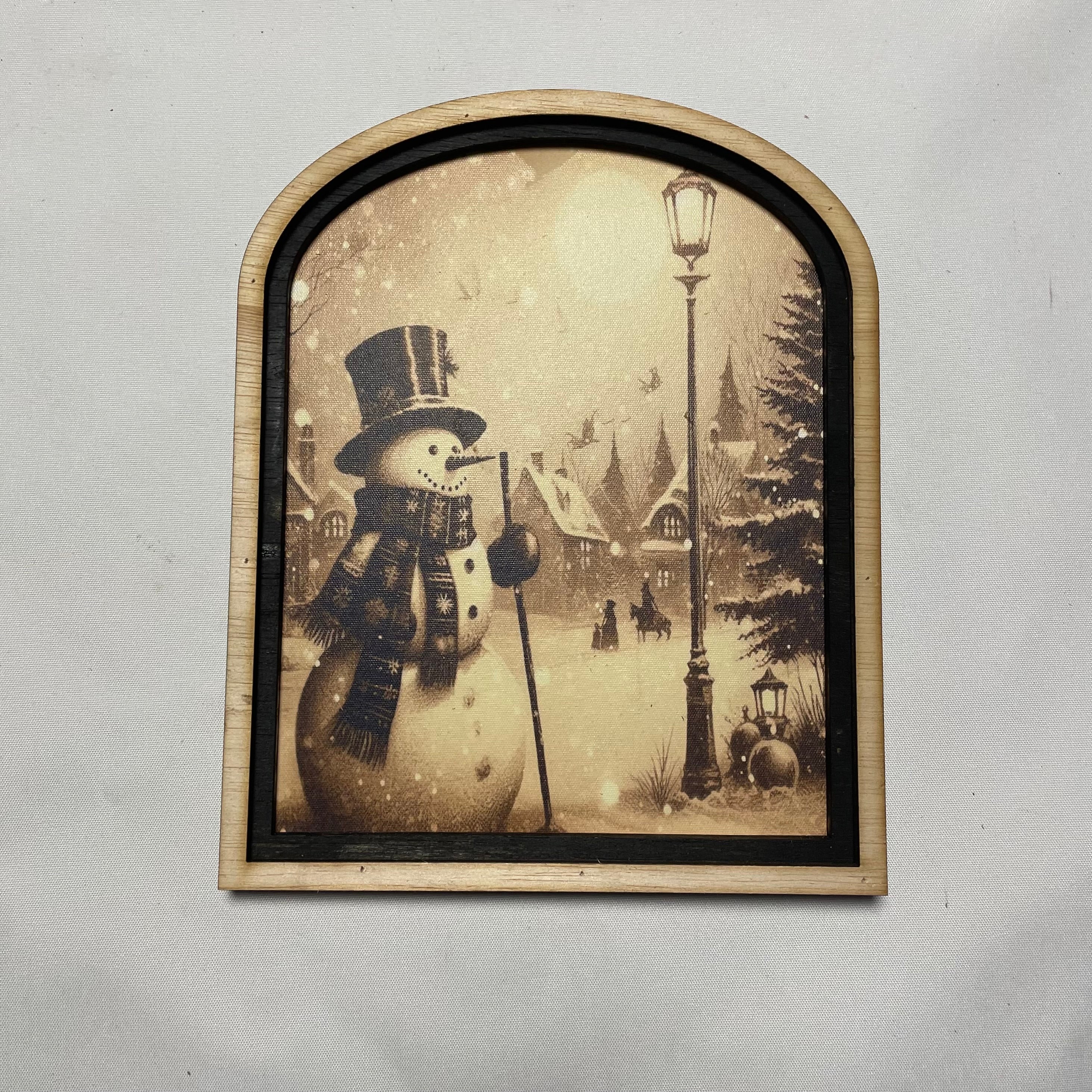 Snowman in Village with Horse and Lamp post framed print