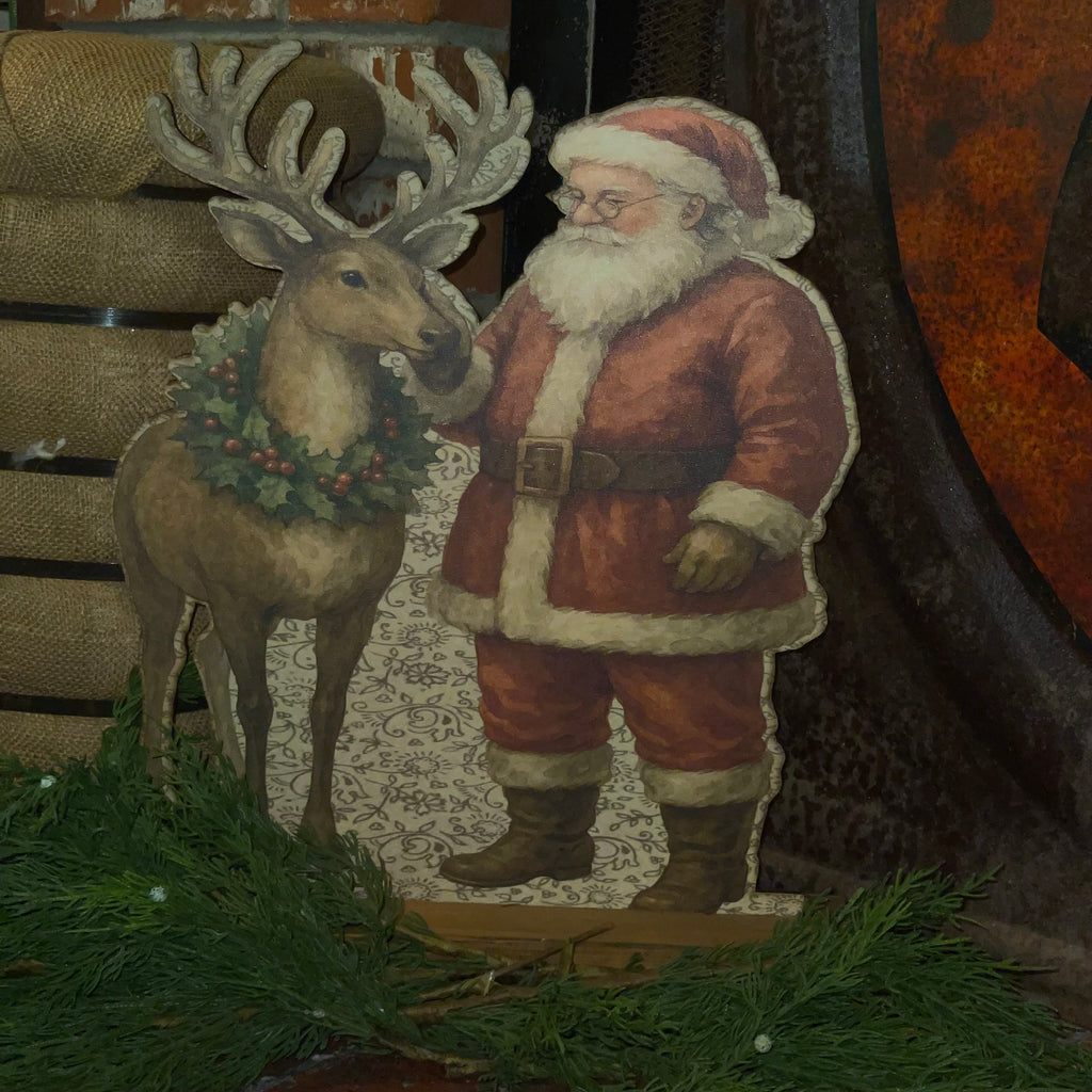Santa rubbing reindeer Standup