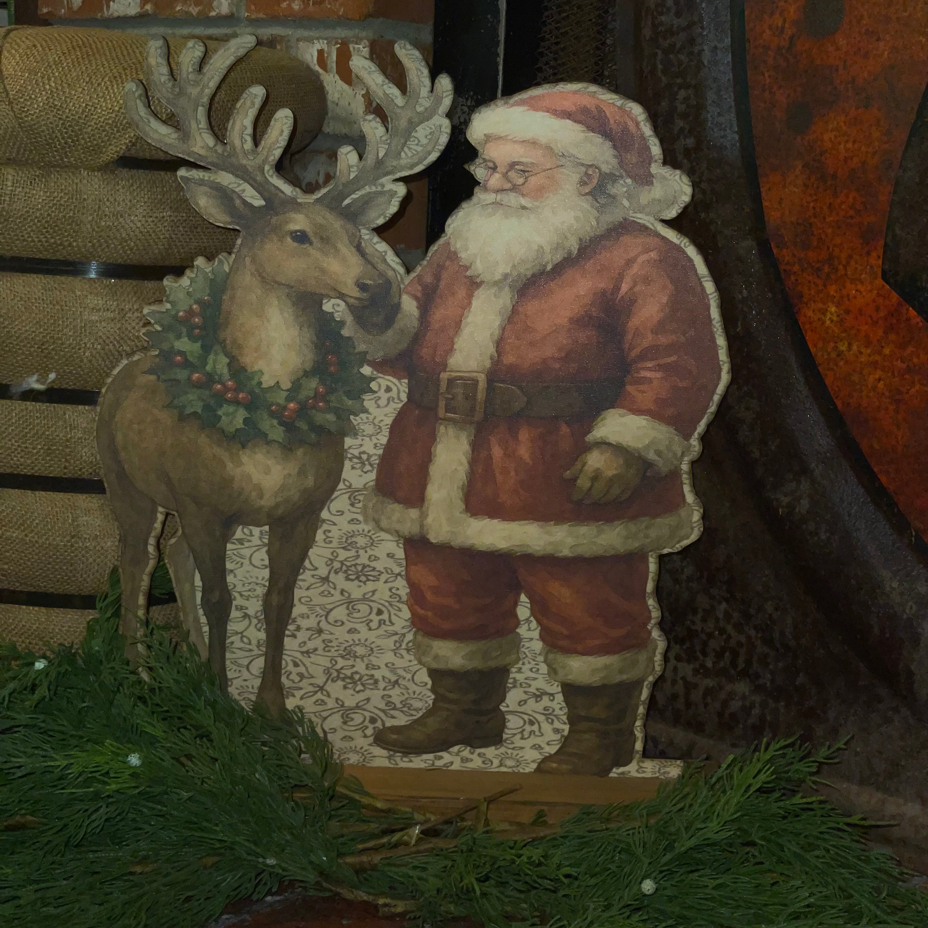 Santa rubbing reindeer Standup