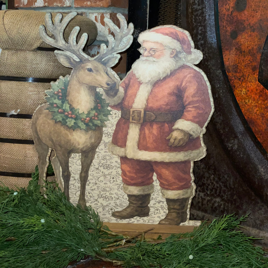 Santa rubbing reindeer Standup