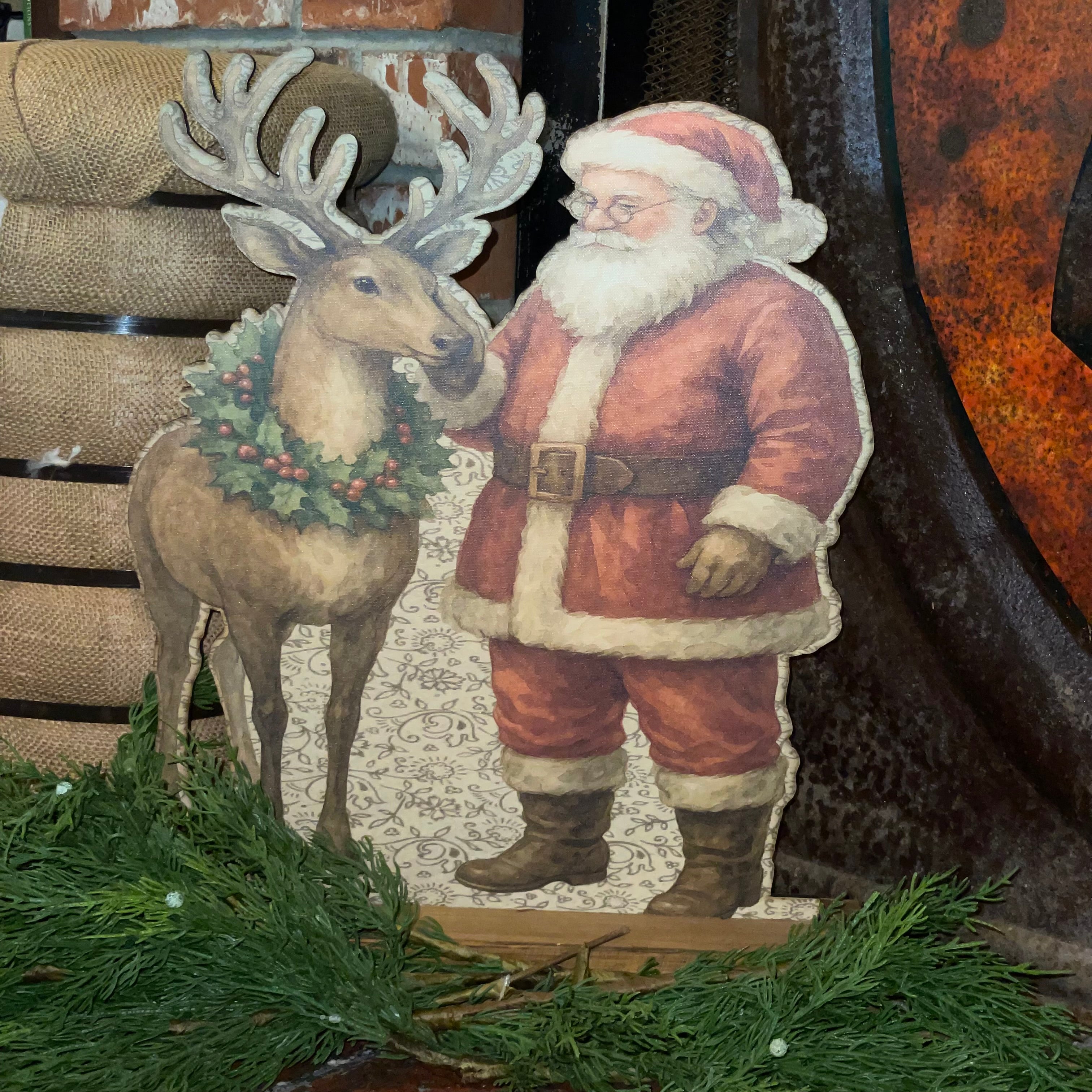 Santa rubbing reindeer Standup