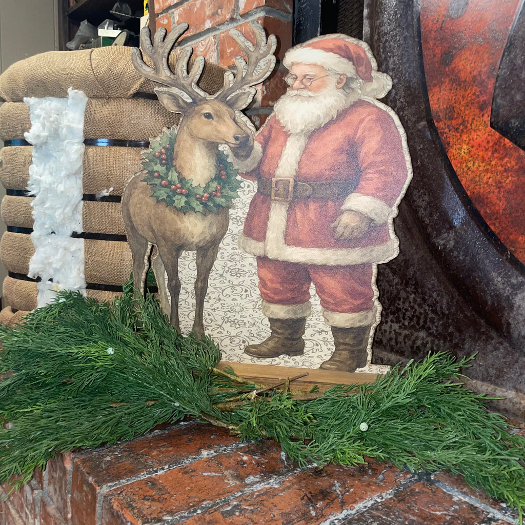 Santa rubbing reindeer Standup