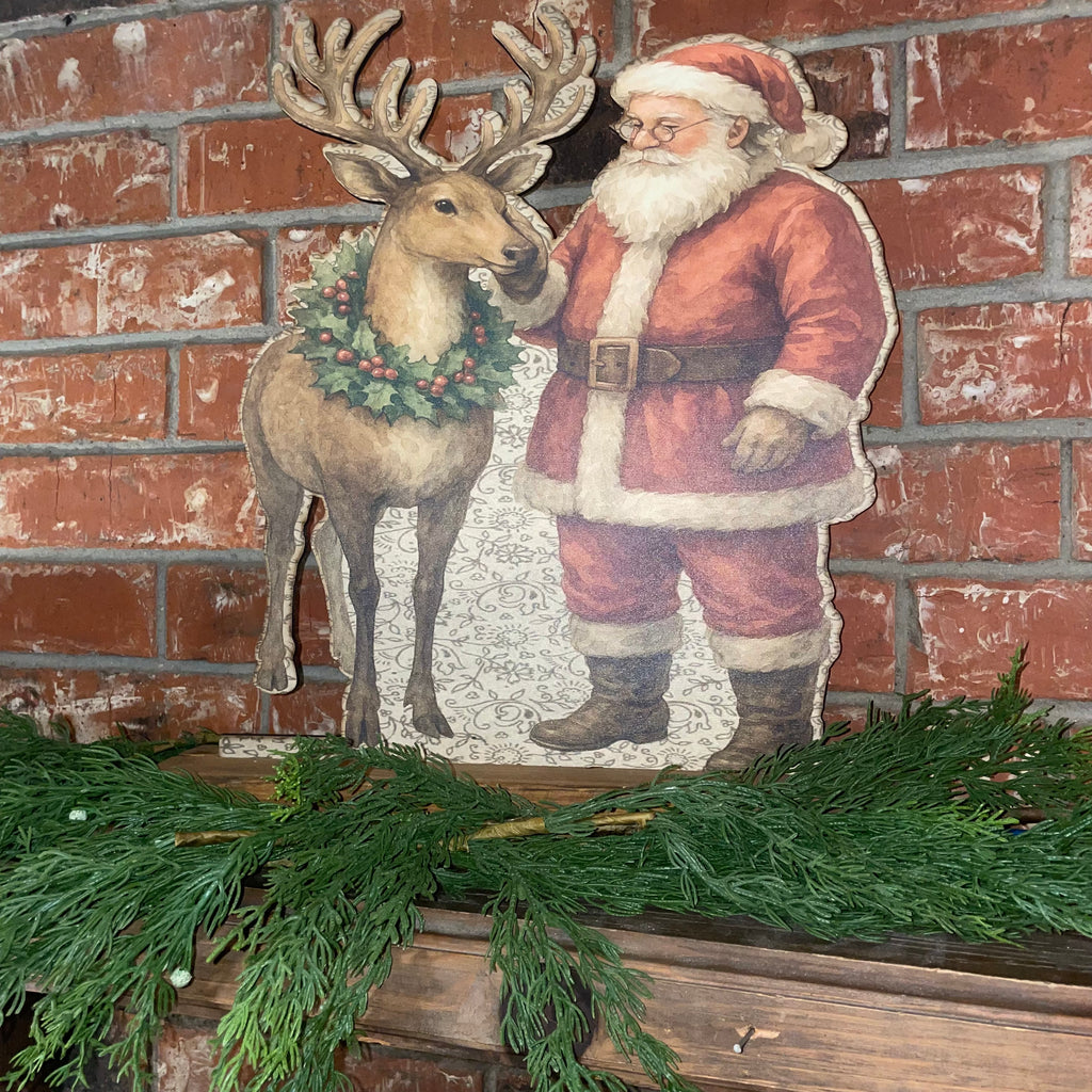 Santa rubbing reindeer Standup