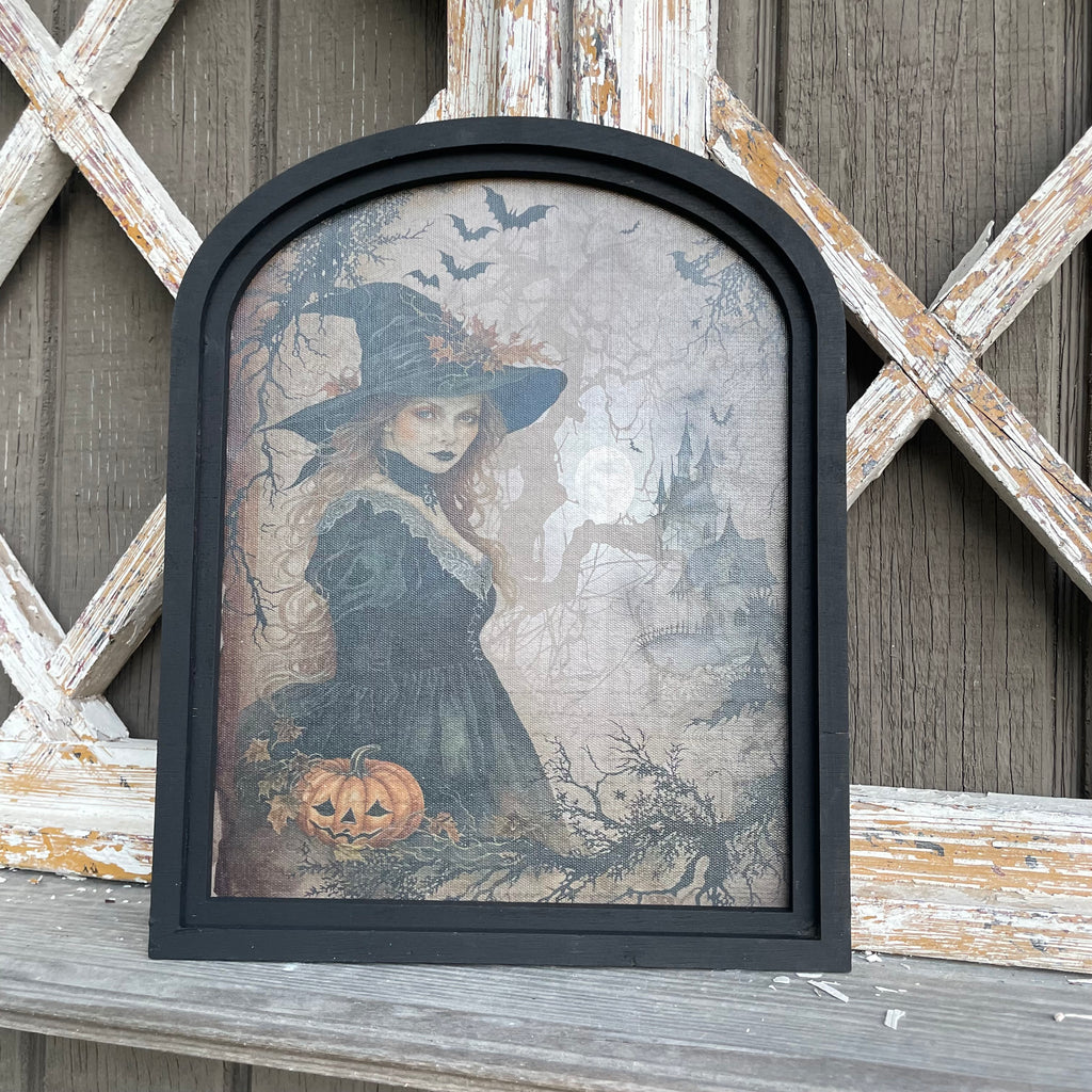 Witch in forest with castle canvas print in small arch