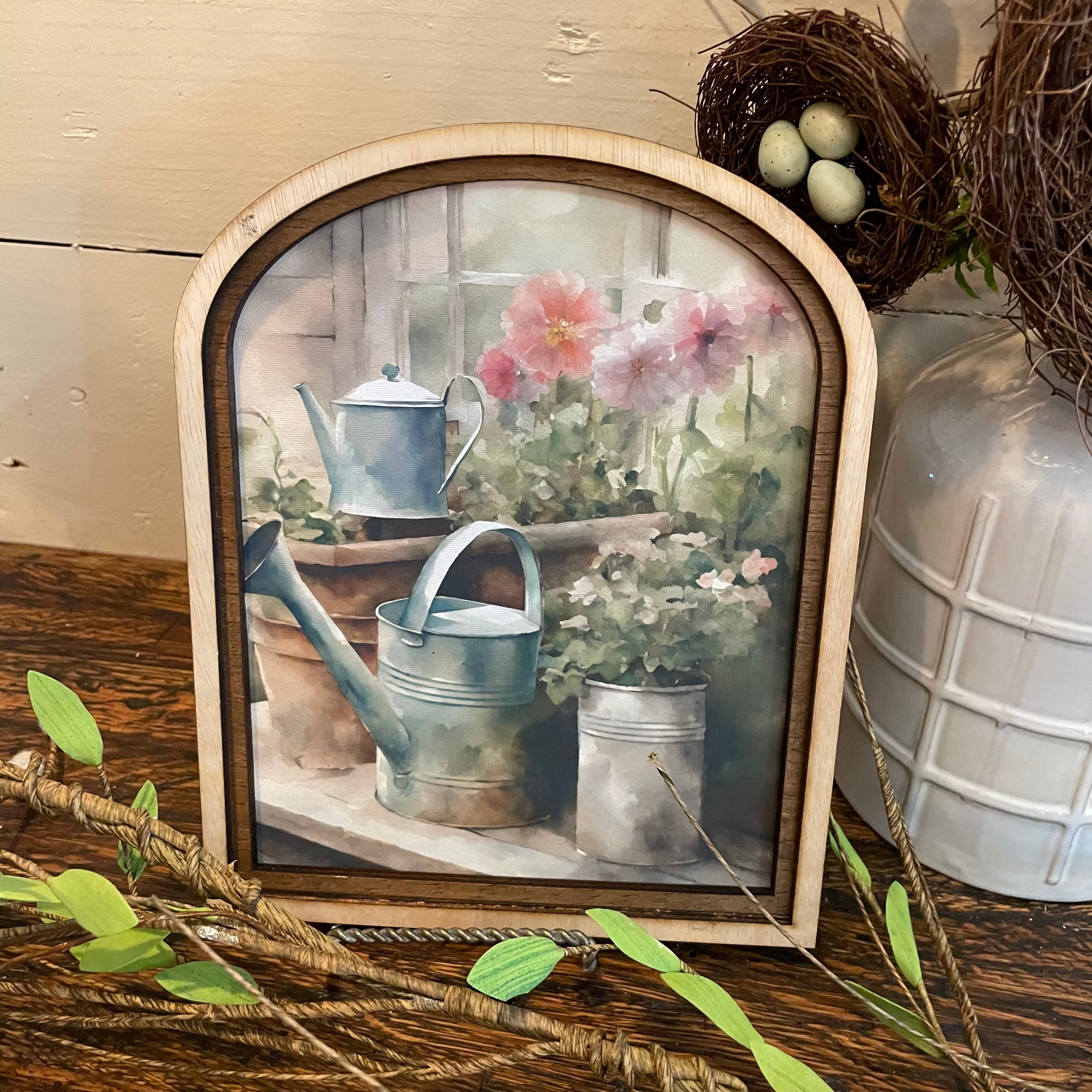 Flower filled Watering cans Print in Arched Frame