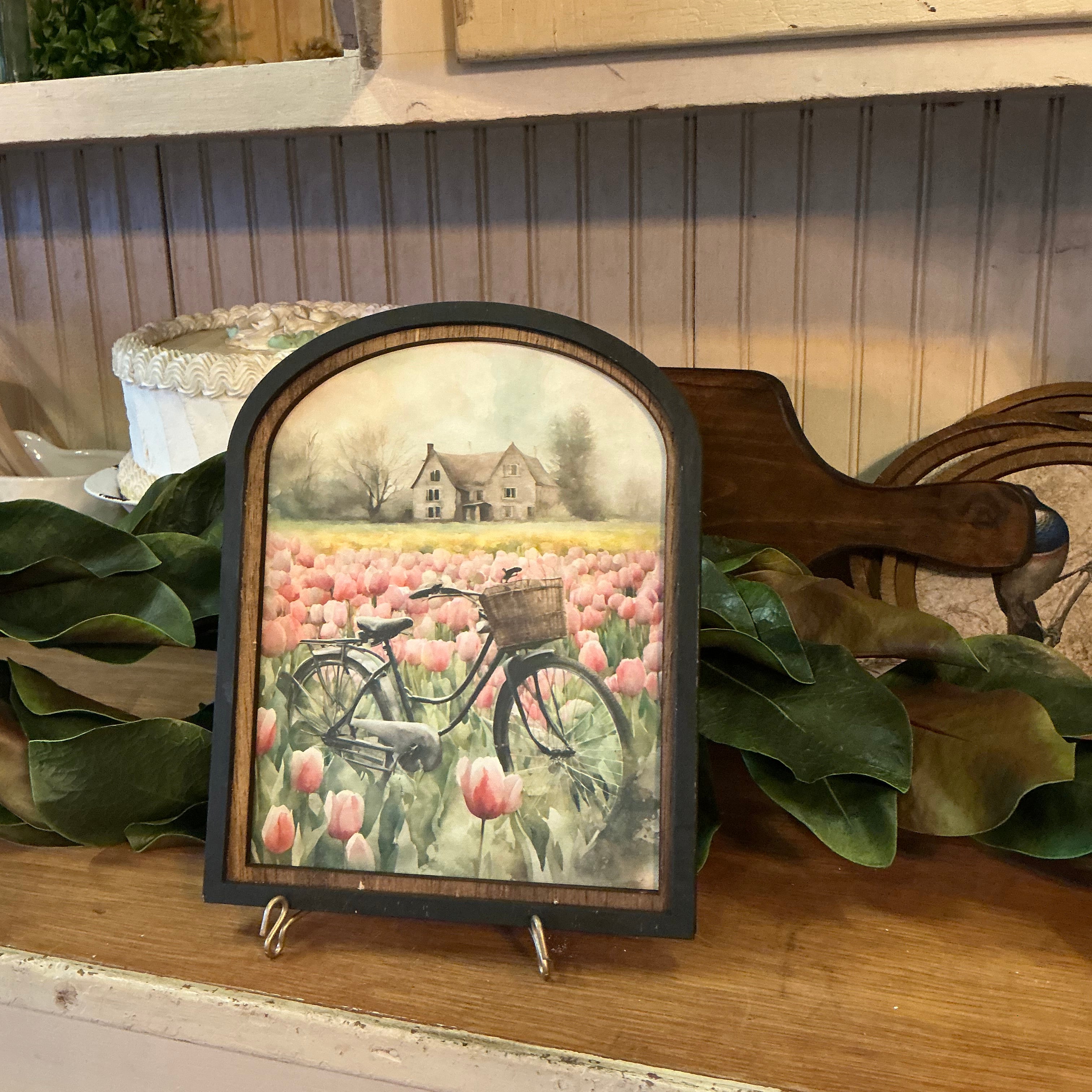 Vintage bicycle in meadow of tulips in Arched Frame
