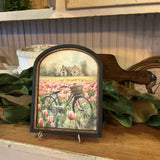 Vintage bicycle in meadow of tulips in Arched Frame