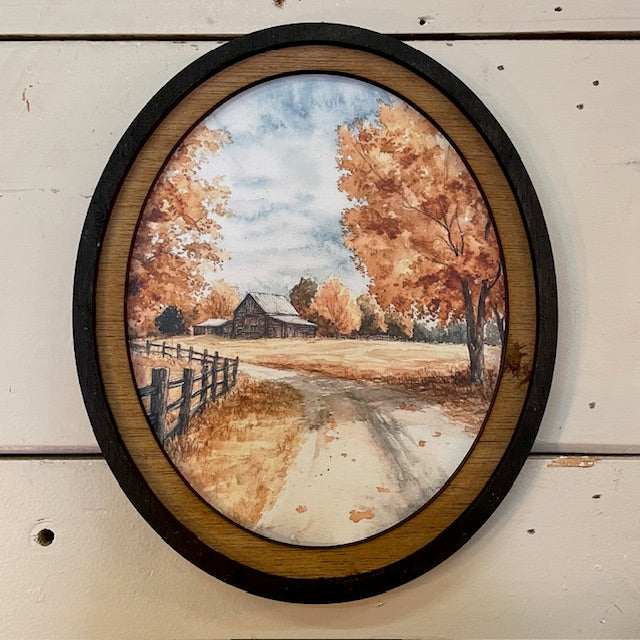 Autumn Barn with county road canvas print in oval frame