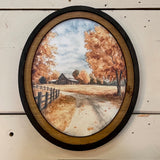 Autumn Barn with county road canvas print in oval frame